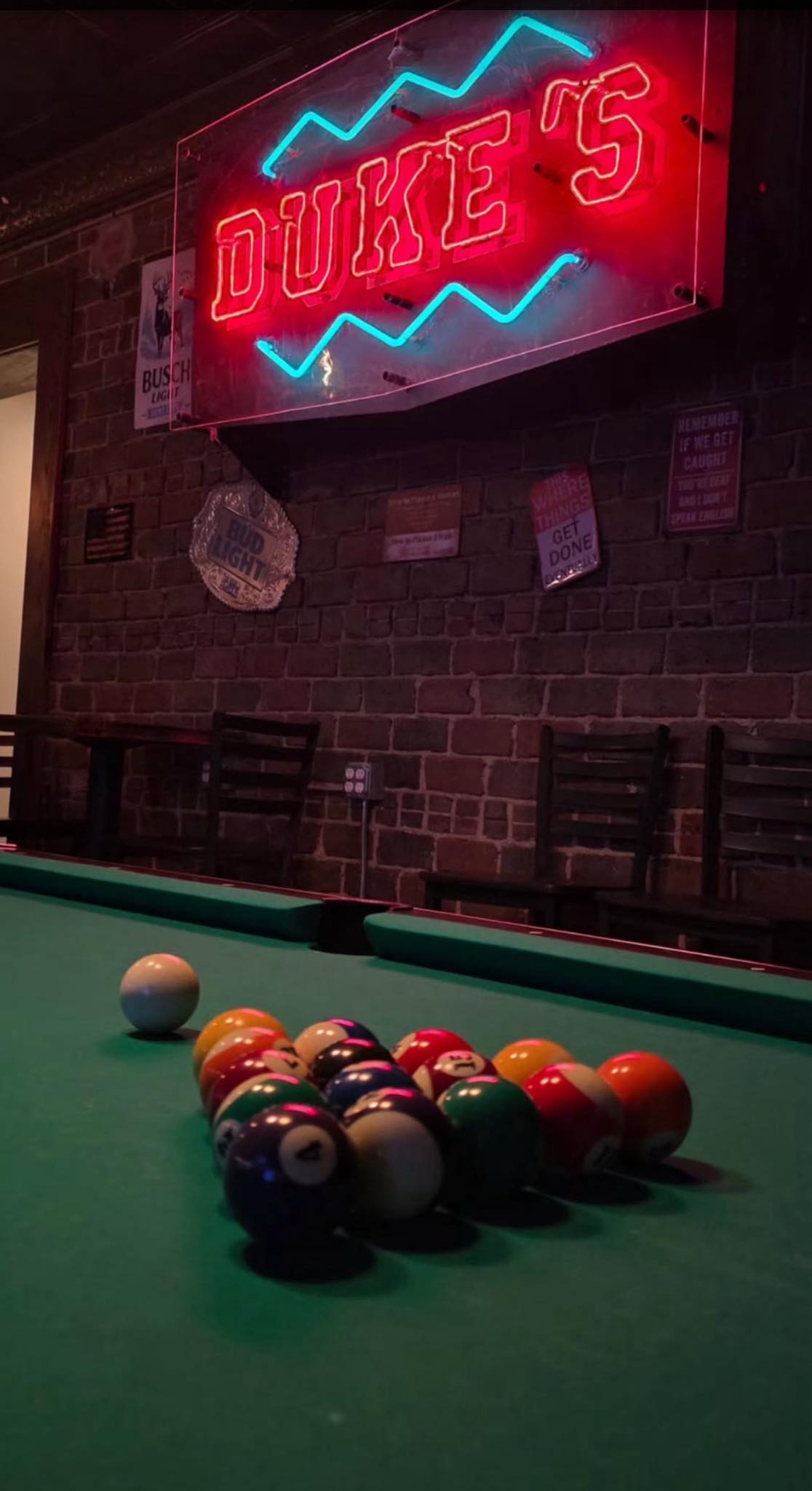 Duke's sign above the pool table
